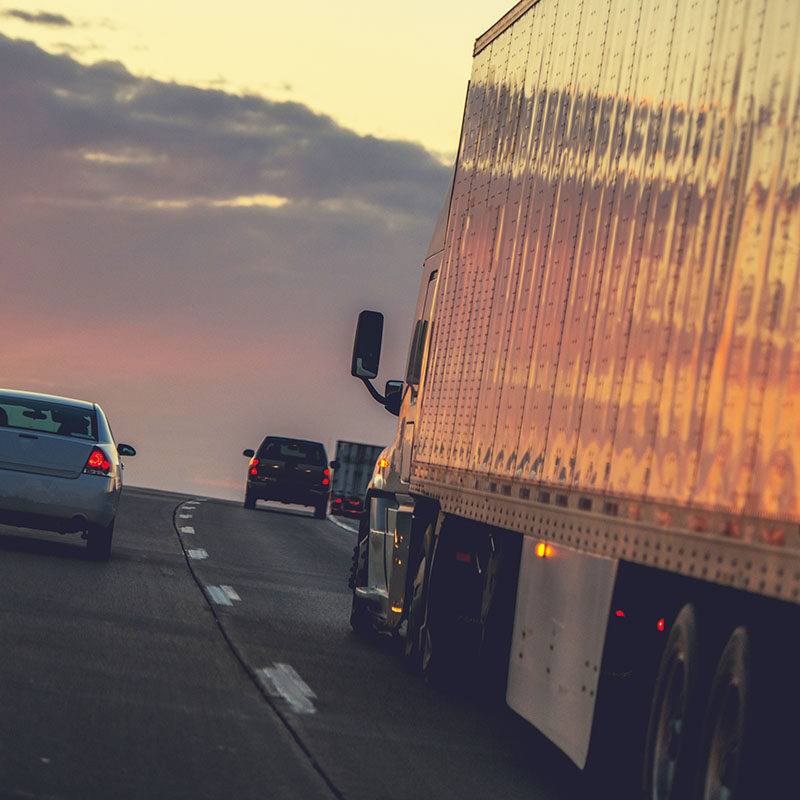 Truck Delivery on the Way. Semi Truck on a Highway.